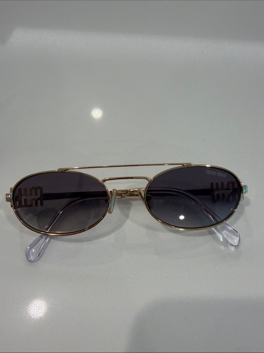 Miu Miu Gold Oval Sunglasses with Dark Gray/Blue  Lenses